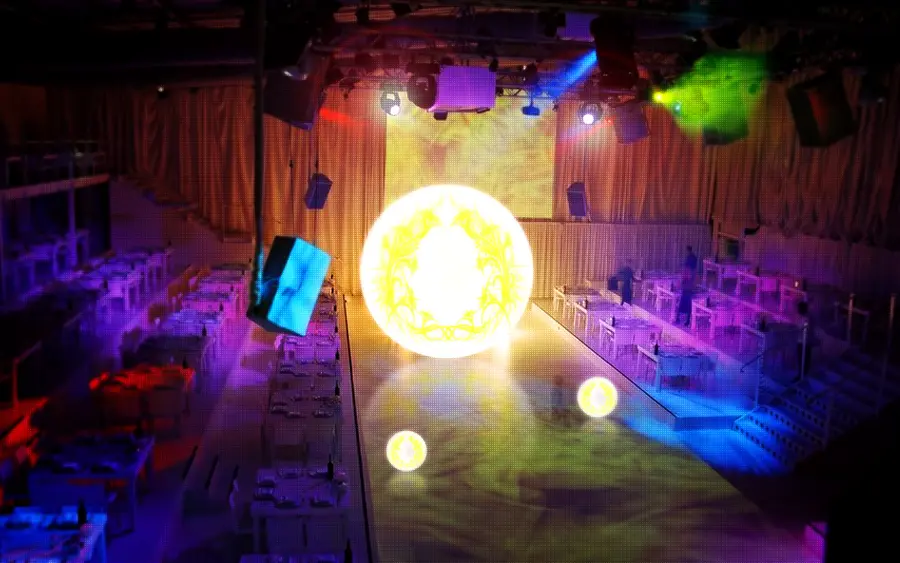 String lights glowing over an evening event